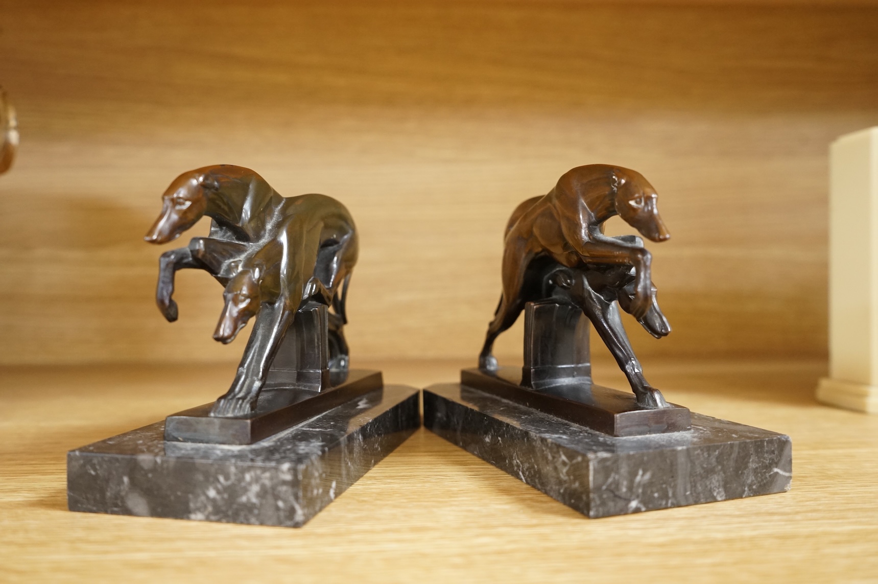 A pair of French Art Deco spelter bookends in the form of racing greyhounds, 14.5cm wide